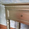 2 drawer console table against blue wall