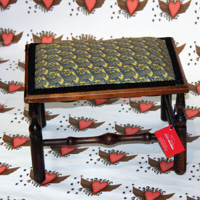 recycled wooden stool covered in bench design fabric, pictured on heart design background
