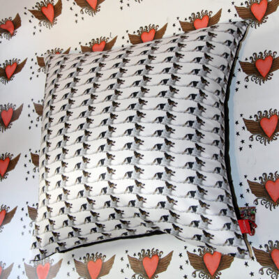 Picture of whole cushion with Collie Dog repeat pattern design, background heart design