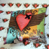 plumped cushion with heart with wings cushion on heart background
